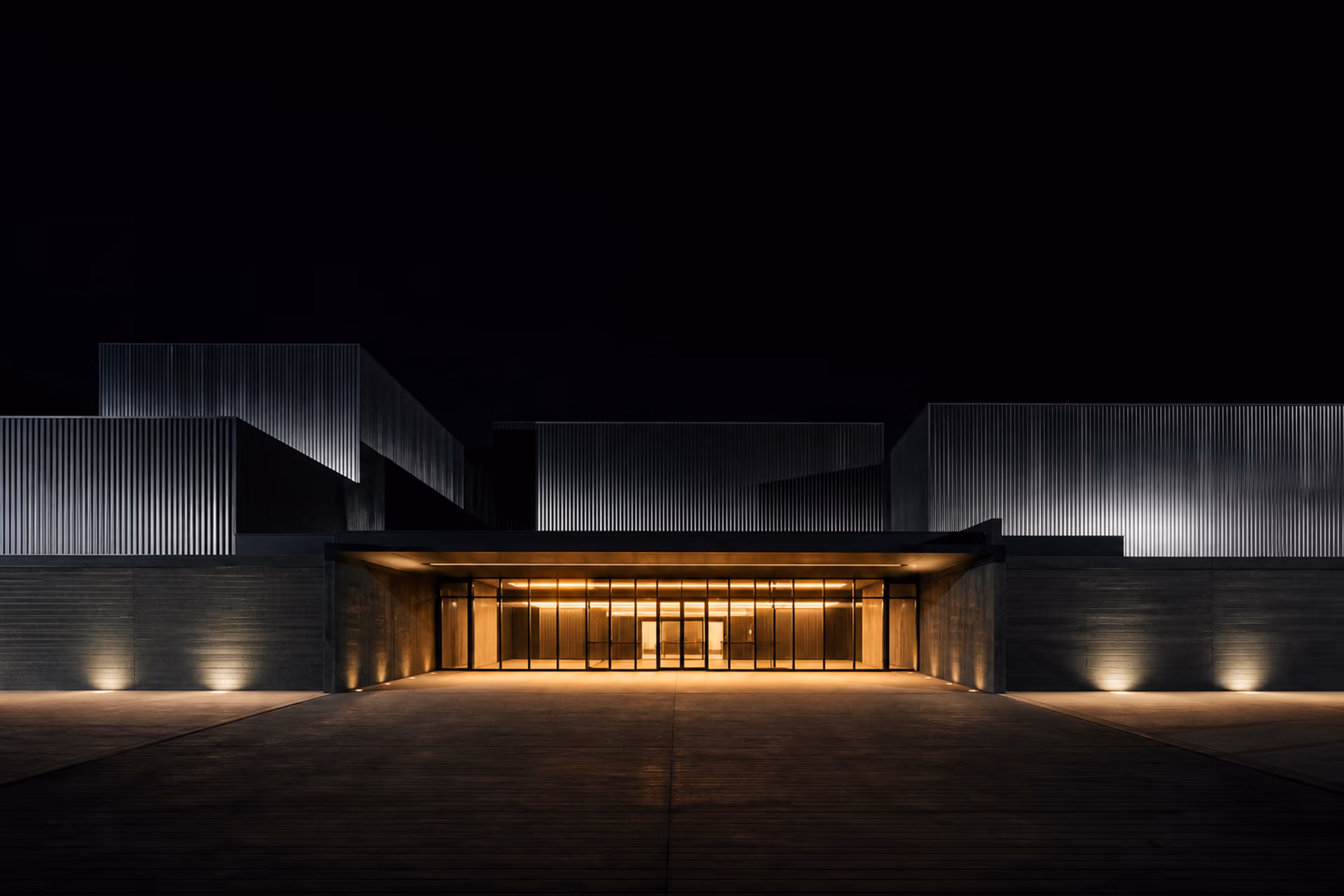 Hard-edged New York launch venue with a warm-lit entrance